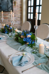 decorated table in the restaurant for a wedding dinner
