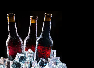 Cold bottles and fresh beer with ice