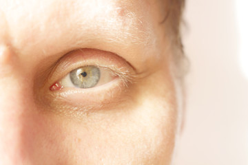 Eye. Left eye. The man is looking at the camera. Part of the face.