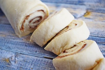 Prepare delicious cinnamon cookies.Dough rolled into a roll, cut into small pieces.