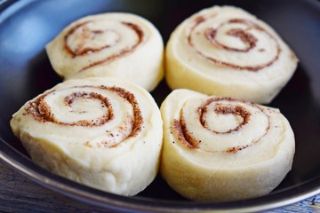 Prepare delicious cinnamon cookies.Dough rolled into a roll, cut into small pieces.