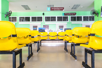 Fototapeta premium Orthopedic examination room, Empty yellow chairs waiting for examination in the hospital, Seat for patients waiting for medical examination.