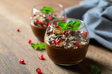 Chocolate Mousse Served with Pomegranate Seeds and Mint, Delicious Dessert