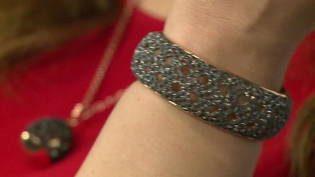 Model advertises jewelry. rings, bracelets, necklaces, earrings
