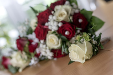Beautiful bouquet of white and red roses for wedding