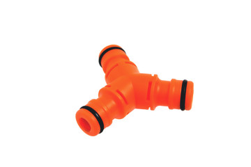 Triple adapter for watering hoses, white background close-up