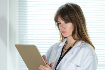 Female doctor using tablet computer
