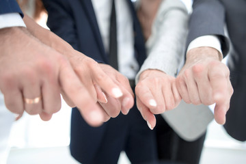 close up.a group of business youth pointing at you
