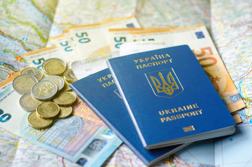 Ukraine passport with money on the map.