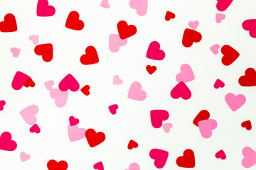 red hearts scattered on a seamless background
