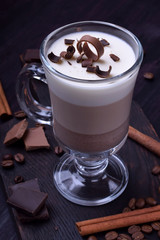 Layered dessert in an Irish glass mug with coffee and chocolate