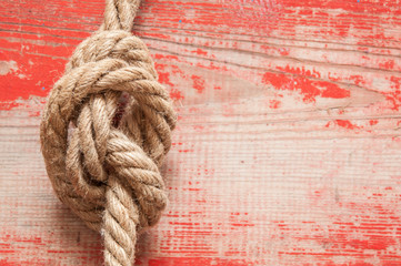 Fototapeta na wymiar ship rope on wooden background
