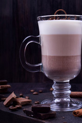 Layered dessert in an Irish glass mug with coffee and chocolate
