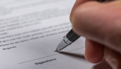 Signing on Business Contract Document