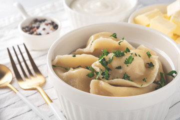 Traditional pelmeni, ravioli, dumplings with meat, close-up.
