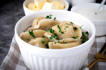 Traditional pelmeni, ravioli, dumplings with meat, close-up.