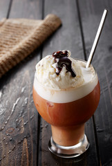 Coffee ice cream on wooden table