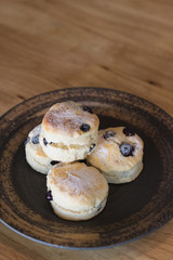 scones on ceramic dish in coffee cafe.