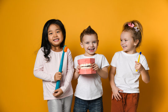 dental hygiene. happy little cute children with toothbrushes.