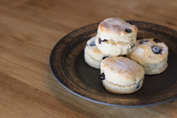 scones on ceramic dish in coffee cafe.