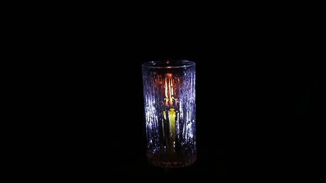 candle light with glass isolated black