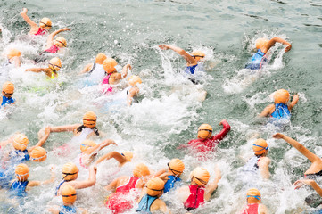 triathlon youth competitors in swim , triathletes in action and motion