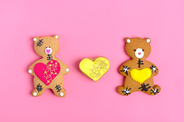 Romantic Teddy bear gingerbread with heart  and star on trendy pink background. Happy Valentine's Day, Mother's Day, March 8, World Women's Day holiday card concept. Flat lay. Top view. Copy  space. 