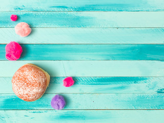 beautiful turquoise carnival background with doughnuts and carnival items