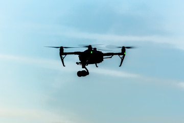 Big professional quadcopter in the sky