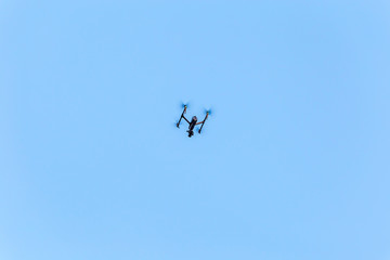 Fototapeta na wymiar Big professional quadcopter in the sky