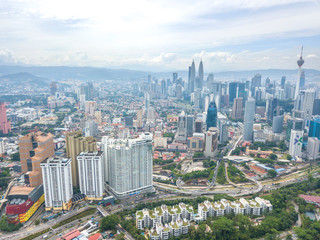Naklejka na ściany i meble KUALA LUMPUR, MALAYSIA - AUGUST 19, 2017: Aerial view of metropilitan city at daylight.