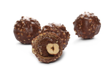 Chocolate balls candy filled with nut isolated on white
