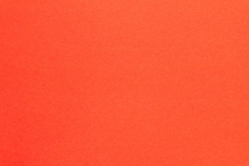 Fototapeta premium The background color of the trend. Red abstract geometric background. The texture of colored cardboard.