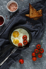 fried eggs with tomatoes