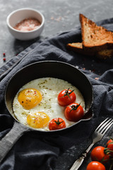 fried eggs with tomatoes