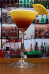 Tequila sunset cocktail in martini glass