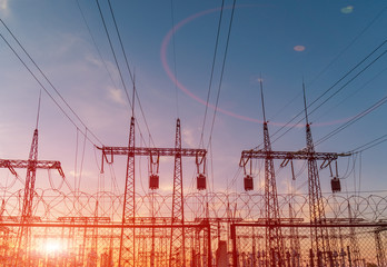 High-voltage power lines. Electricity distribution station. high voltage electric transmission tower. Distribution electric substation with power lines and transformers