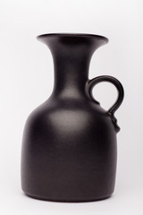 Old black vase  on the white background