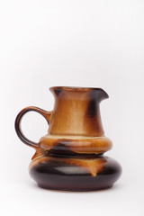 Old brown vase, teapot  on the white background