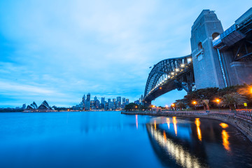 SYDNEY, AUSTRALIA - SEPTEMBER 08, 2016: Sunset view of Sydney Harbour Bridge. More than 15 million people visit Sydney annually.
