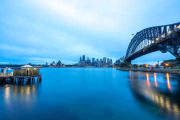 SYDNEY, AUSTRALIA - SEPTEMBER 08, 2016: Sunset view of Sydney Harbour Bridge. More than 15 million people visit Sydney annually.