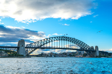 SYDNEY, AUSTRALIA - SEPTEMBER 08, 2016: Sunset view of Sydney Harbour Bridge. More than 15 million people visit Sydney annually.