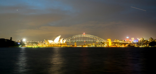 SYDNEY, AUSTRALIA - SEPTEMBER 08, 2016: Night view of Sydney Harbour. More tha 15 million people visit Sydney annually.
