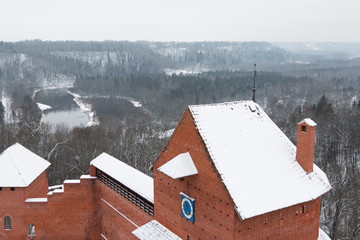 Sigulda in Latvia Turaida castle. River and forest on the background. Winter.