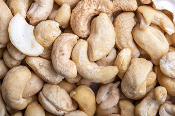 Fototapeta premium Tasty cashew nuts as background, top view