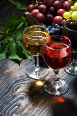 assortment different wine on wooden background, vertical top view