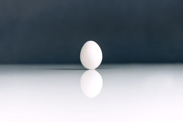 White egg is isolated on a contrasting background. Concept Of Easter. Concept of healthy eating.