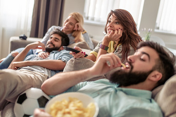 Friends watching football game