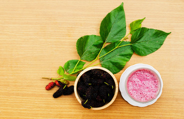 Homemade mulberry juice drink on wood backgrounds above