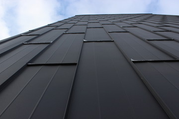 the texture of iron sheets, the prospect of the sky. the modern decor of the facade, background